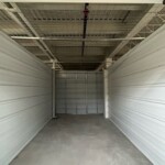 Large indoor storage unit with white metal walls